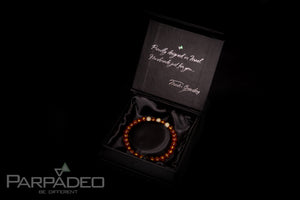 Red Sanskrit Bracelet by Parpadeo. Designed and handmade in Israel by Martin Greenberg